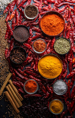 Variety of spices and herbs on kitchen table