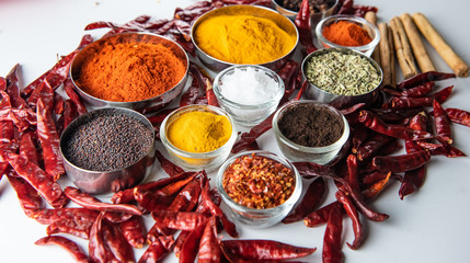 Variety of spices and herbs on kitchen table