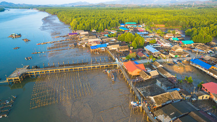 during low tide fishing boats stuck on the mud in Ban Sam Chong fishing village