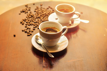 Hot coffee and coffee beans on the table