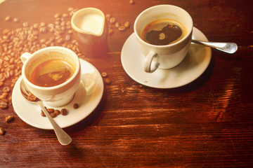 Hot coffee and coffee beans on the table