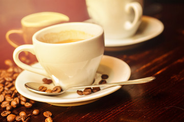Hot coffee and coffee beans on the table