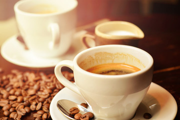 Hot coffee and coffee beans on the table