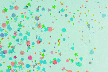Mint green trendy festive background with colorful neon decorative elements. Hearts, stars, circles. Space for text
