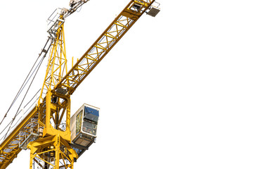 Yellow construction crane on a white isolated background builds multi-storey residential buildings using modern technologies of metal, concrete and brick according to the architectural design