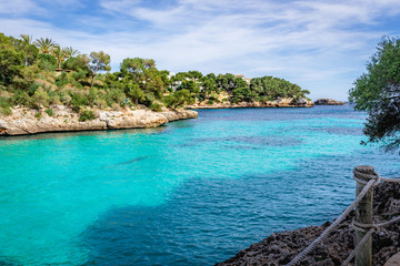The beach Cala Ferrera with turquoise crystal waters in the south-east of Mallorca. Spain