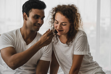 Couple love choosing clothes from wardrobe in bedroom. couple love lifestyle, clothing, fashion, family style and people concept.