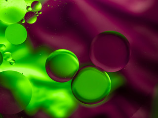Colourful surreal psychedelic abstract liquid background. Water and oil drops with small air bubbles