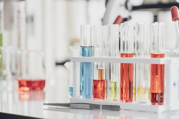 Team of Medical Research Scientist Conducts Experiments in Laboratory with Microscope, Test Tubes, Micropipette and other equipment.