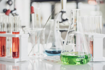 Team of Medical Research Scientist Conducts Experiments in Laboratory with Microscope, Test Tubes, Micropipette and other equipment.