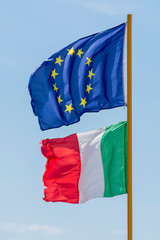 Two flags of Italy and European Union  fluttering in the wind