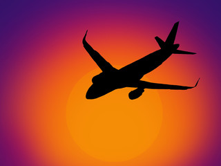 plane flying away into the distance at sunset.