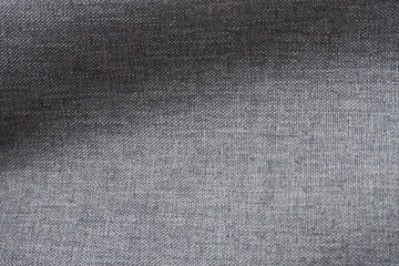 Closeup of glossy cotton mixed with polyester fabric in dark grey tone for textile texture. For making cool banner and background, page, ad, presentation and website