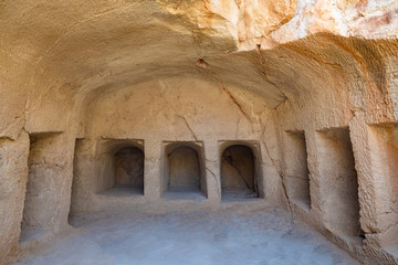 Republic of Cyprus. Pathos. Royal tombs in Paphos. Tombs of kings. Ancient grave niches in stone. Archaeological site of Paphos. Tourist attractions in Cyprus.