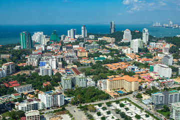 Fototapeta na wymiar Panoramic view of Thailand from a height. Pattaya city on a summer day. Vacation in Thailand. The Architecture Of Pattaya. City by the sea.