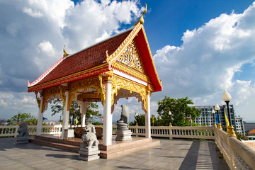 Fototapeta premium Thailand. Buddhist temple. Religious building. The Attractions Of Pattaya. Religion Buddhism. Artful carving of a Buddhist temple. Red, gold and white colors.