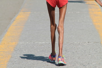 Slim girl in white lingerie lying on the floor in an abandoned room