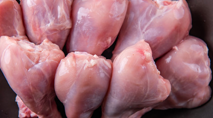 Raw chicken on the table top in the kitchen.