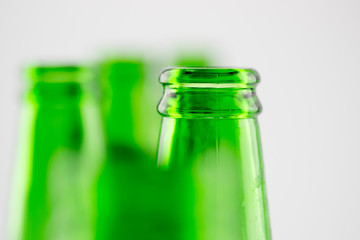 Colorful empty beer bottles, lots of empty beer bottles. Closeup, daylight. Beer's over, party's over.