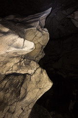 Impressive, alien shapes inside the massive cave and dark, spooky background