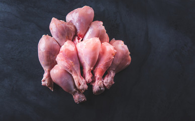 Raw chicken on the table top in the kitchen.