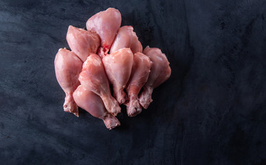 Raw chicken on the table top in the kitchen.