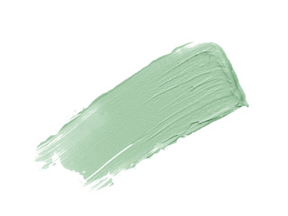 Color corrector stroke isolated on white background. Mint freen correcting cream concealer smudge...