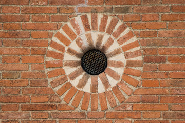 close up of a wall made of orange bricks