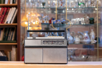 Vintage transistor radio on blurred background