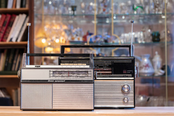 Vintage transistor radio on blurred background