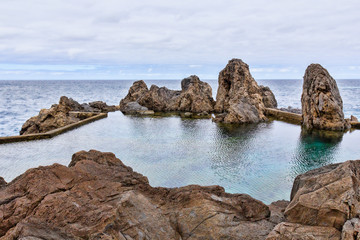 Fototapeta na wymiar Natural lava rock pool and sea in Porto Moniz in Madeira