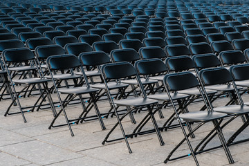 rows of folding chairs, empty seats ion event - chair row - - obrazy, fototapety, plakaty