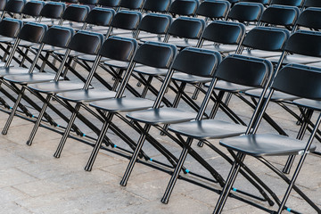 rows of folding chairs, empty seats ion event - chair row -