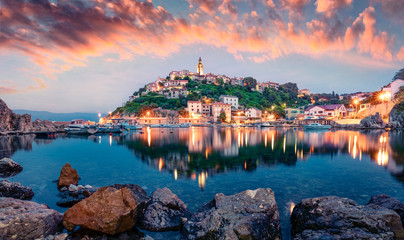 Breathtaking evening cityscape of Vrbnik town. Dramatic summer seascape of Adriatic sea, Krk island, Croatia, Europe. Beautiful world of Mediterranean countries. Traveling concept background.