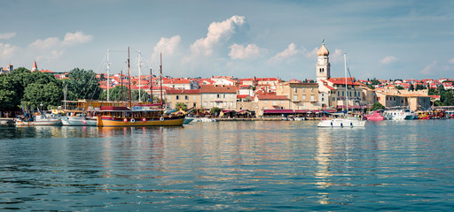 Fototapeta na wymiar Sunny morning cityscape of Krk port. Amazing summer seascape of Adriatic sea, Krk island, Croatia, Europe. Beautiful world of Mediterranean countries. Instagram filter toned.