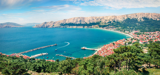Fototapeta premium Aerial morning view of Bashka town. Col.orful summer seascape of Adriatic sea, Krk island, Kvarner bay archipelago, Croatia, Europe. Beautiful world of Mediterranean countries.