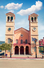 Fototapeta premium Picturesque morning view of Pantokrator Church. Bright spring cityscape of Lixouri town. Splendid outdoor scene of Kefalonia island. Architecture traveling background.