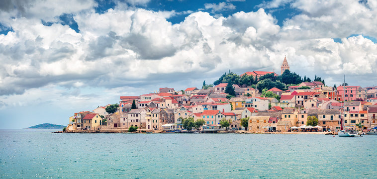 Cloudy summer view of Primosten town. Splendid morning seascape of Adriatic sea, Croatia, Europe. Beautiful world of Mediterranean countries. Traveling concept background.