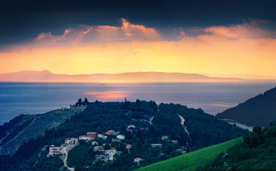 Dramatic evening seascape of Adriatic sea. Fantastic sunset in Croatia with Rizman wineyard, Kremena village location. Beautiful world of Mediterranean countries. Traveling concept background.