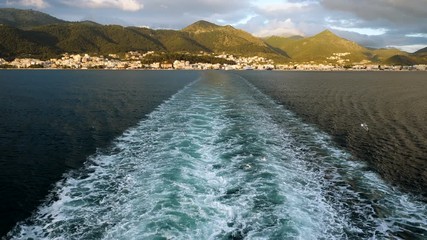 Trail on water from boat floating in Mediterranean sea. Greece. 4K