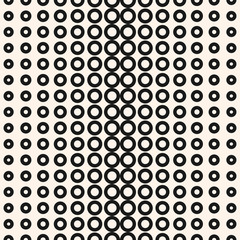 Halftone circles pattern. Seamless geometric texture with different sized rings