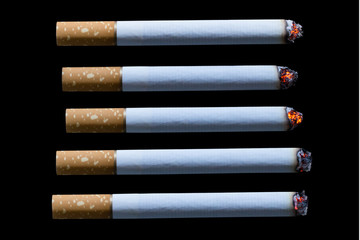 Cigarette burning isolated on black background with clipping path