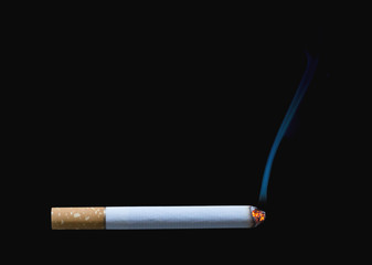 Cigarette burning isolated on black background