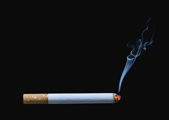 Cigarette burning isolated on black background