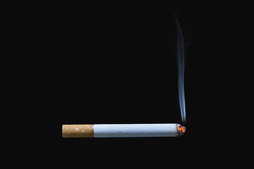 Cigarette burning isolated on black background