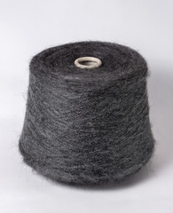 bobbin of yarn on a white background. Side view.Textile reel on isolated white background.