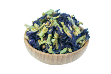 Dried butterfly pea on bowl wood isolated on white background with clipping path