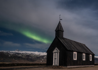 Northern lights aurora borealis Black church in Iceland