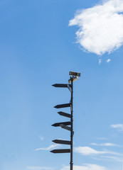 Blank directional road signs against blue sky. Directional sign post.