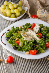 salad provence with blue cheese on wooden table